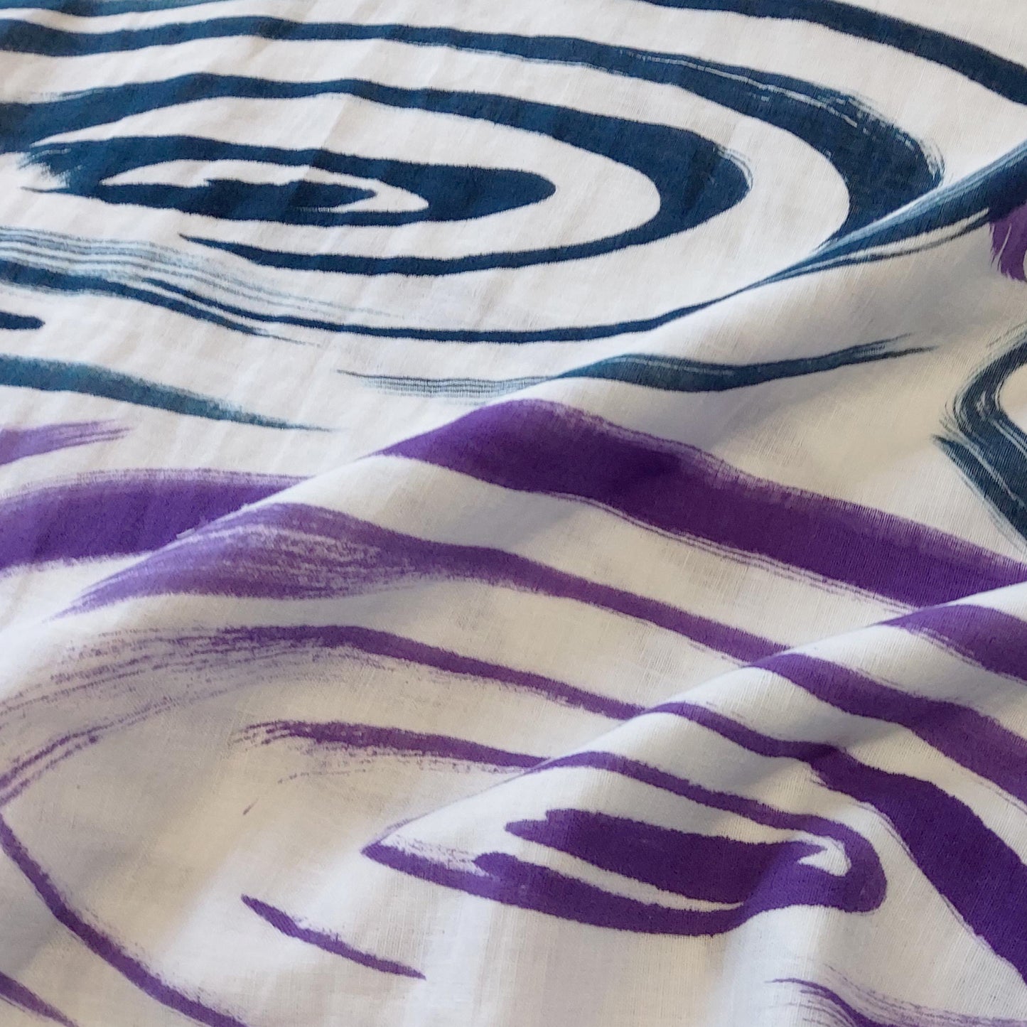 Rain drops falling into a pond